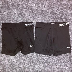 2 pairs of Nike spandex, color black, woman’s size small